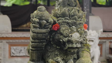 Stone-statue-of-Hindu-god-at-Ubud-Palace-in-Bali,-Indonesia,-close-up-parallax