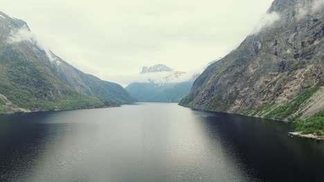 Iconic-mountain-landscape-and-lake-of-Eikesdalsvatnet-in-Norway,-aerial-view