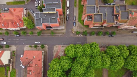 Red-apartment-buildings-of-Klaipeda,-aerial-top-down-view