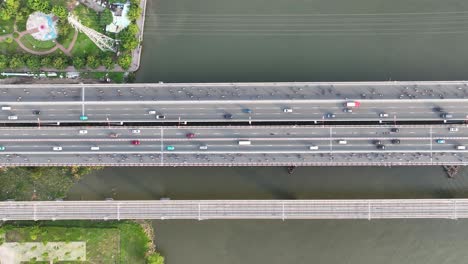 City-residents-commute-across-river-bridge,-famous-Vietnam-landmark