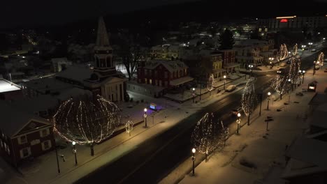 Quaint-American-town-covered-in-snow-during-winter-night