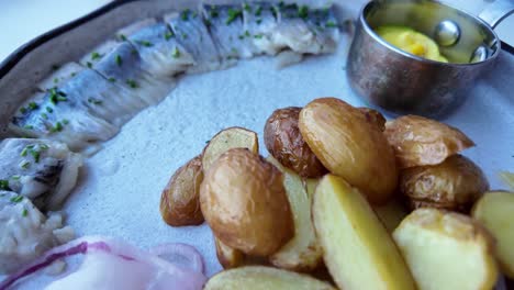A-plate-of-Swedish-herring-with-fried-potatoes-and-red-onion