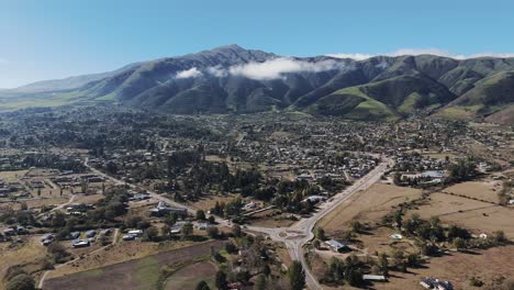 Aerial-view-of-a-town-surrounded-by-the-Andean-mountain-range-in-northwest-Argentina