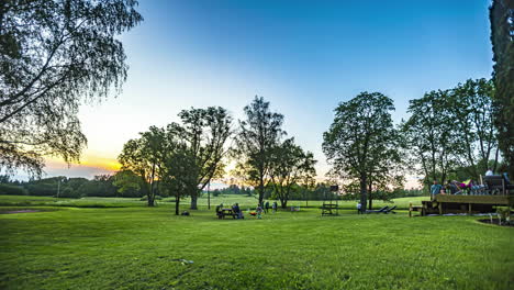 Sunset-party-in-the-countryside-near-Riga,-Latvia---time-lapse