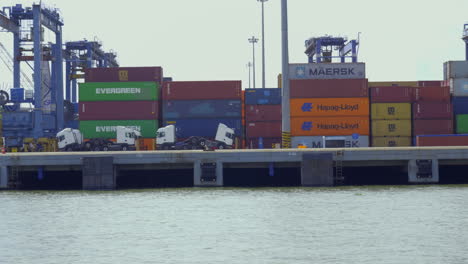 DP-world-container-terminal-in-kochi,-a-cargo-ship-waiting-for-loading-,crane-and-containers-loading-containers-in-cargo-ship