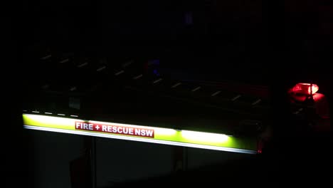 NSW-Ambulance-close-up-lit-logo-at-night