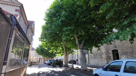 Next-to-the-church-in-Fayence,-France,-there-is-a-shaded-car-park-and-a-little-town-square