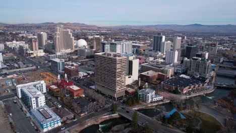 Downtown-Reno-Nevada-USA-Cityscape-Skyline,-Aerial-View-of-Central-Buildings-and-Casinos,-Drone-Shot