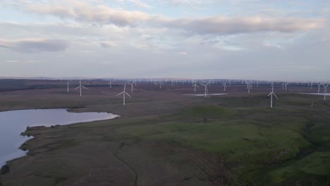 Wind-mills-spin-electricity-on-rugged-Scottish-moor-near-Glasgow