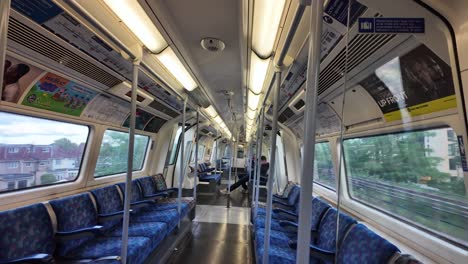 Empty-interior-of-a-modern-city-train-with-blue-seats-and-large-windows,-capturing-urban-transportation-mode