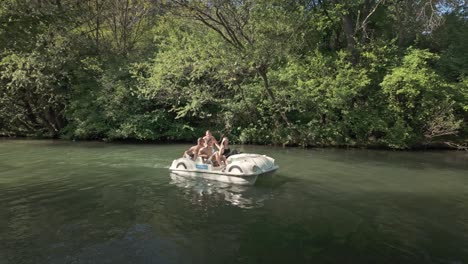 Four-young-friends-enjoy-pedalo-boat-trip-activity-fun-on-Zlatna-Panega-River