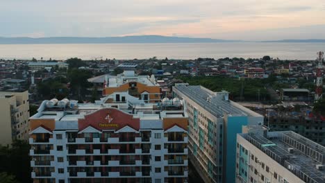 Drone-Aerial-view-of-Modernizing-housing-estates-in-the-southern-Philippines'-capital-city-enhances-urban-living-with-contemporary-amenities,-eco-friendly-designs,-and-improved-infrastructure