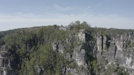 Bastei-viewpoint-in-Elbe-Sandstone-Mountains,-Neurathen-rock-castle,-aerial-view
