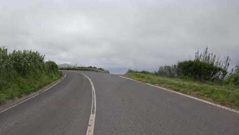 Empty-rural-road-on-a-cloudy-day-near-Ponta-Delgada,-Azores