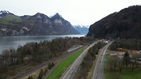 Highway-motorway-near-Lake-Walensee-and-Swiss-Alps-mountains-Switzerland