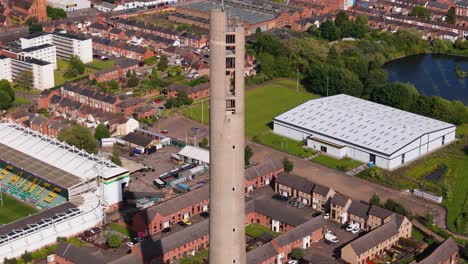 Northampton-National-lift-tower-aerial-rising-view-with-Saints-rugby-stadium-team-ground-below