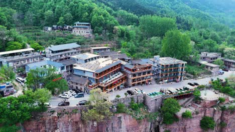 Aerial-of-residential-buildings-perched-atop-cliffs-near-the-Guoliang-Tunnel-in-Huixian,-Henan-Province,-China