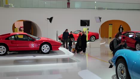 Ferrari-308-GTB-Berlinetta-coupe,-Dino-246-and-other-supersport-cars-in-in-Museum-Enzo-Ferrari-Modena,-panning-shot