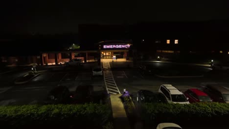 Aerial-approaching-shot-of-american-hospital-entrance-at-night