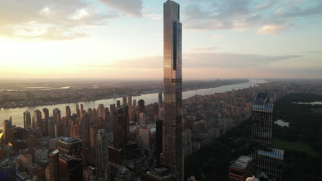 Aerial-view-of-a-residential-luxury-tower-facing-Central-Park,-golden-hour,-New-York-City