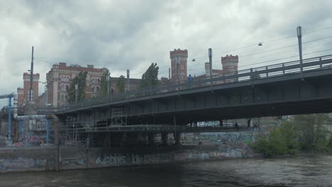 Scaffolders-building-scaffold-under-Vienna-bridge-crossing-canal