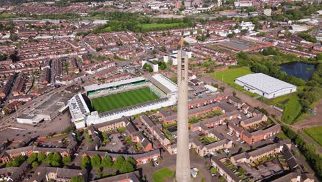 Aerial-view-circling-Northampton-Saints-rugby-stadium-team-ground-and-National-lift-tower-landmark