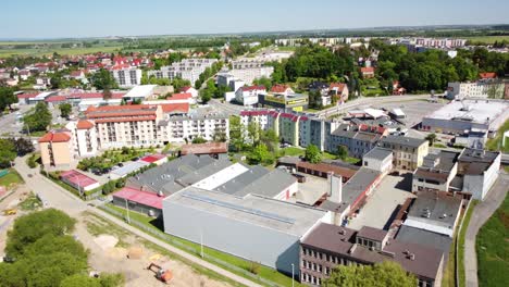 Prudnik's-urban-and-industrial-areas,-modern-buildings,-green-spaces,-and-the-scenic-countryside