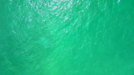 Aerial-view-straight-down-at-blue-green-water-at-the-Italian-sea