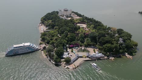 Horizontal-panning-drone-footage-of-Nanzhao-Amorous-Island-in-Dali,-Yunnan,-China