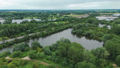 Drone-view-of-greenery-at-East-Sussex-with-St-Neots-Barford-road-and-lakes-in-England