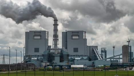 Timelapse-of-factory-spewing-smoke,-pollution-in-Eemshaven,-Netherlands