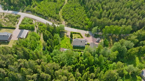 Aerial-tilt-shot-rotating-over-a-solar-powered-house-on-the-sunny-countryside