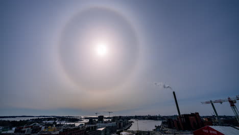 Timelapse-of-a-sun-Halo-above-the-Helsinki-city-skyline,-sunny,-spring-day