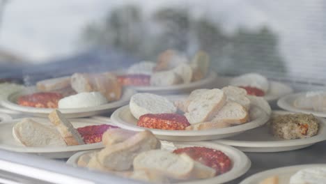 Slow-orbiting-shot-of-a-large-collection-of-bread-and-cheese-plated-for-guests