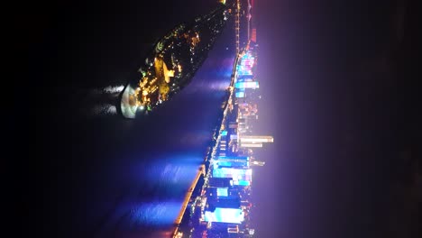 Vertical-aerial-shot-of-the-famous-Changsha-Skyline-at-night,-China
