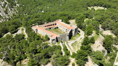 High-Angle-Aerial-View-of-Military-Fort-Faron-in-Toulon---Sunny-Day