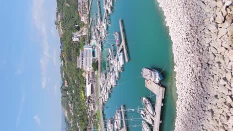 Vertical-aerial-view-of-boats-moored-at-harbour-of-Marina-Ocean-World-in-Puerto-Plata-Dominican-Republic