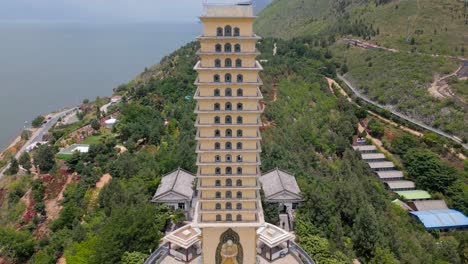 Close-up-Drone-footage-of-the-Luo-Quan-Tower-Panning-to-Er-Hai-in-Dali,-Yunnan,-China