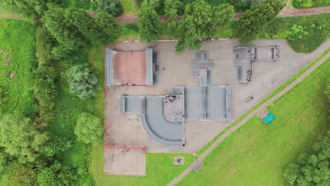 Top-view-of-skating-area-with-children-skating-in-Priory-Park-at-Huntingdonshire,-England