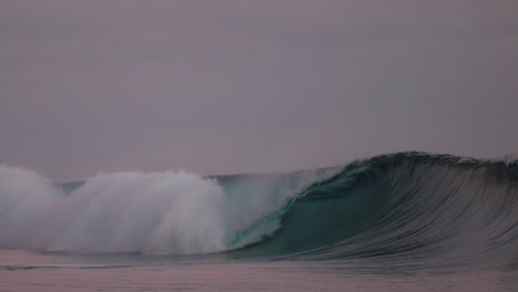 Teahupo'o-stunning-monstrous-famous-surfing-barrel-wave-Tahiti-French-Polynesia-slow-motion-coral-reef-foam-ball-Paris-summer-Olympics-2024-offshore-dreamy-sea-sunset-Passe-Havae-Pacific-Ocean-pan