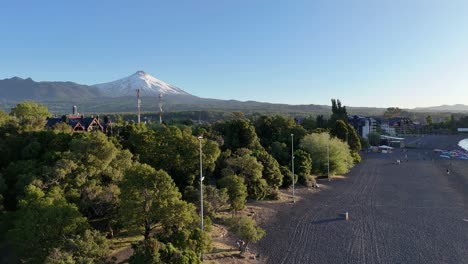 Aerial-view-of-the-countryside-in-Pucon,-Chile-with-the-Villarrica-volcano-in-the-background