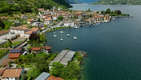 Aerial-flyover-of-picturesque-Italian-village-on-shore-of-Lake-Orta,-Italy