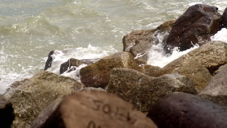 Waves-ocean-sea-crashing-against-rock-formation-rough-sea