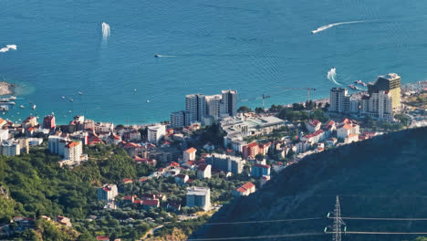 Aerial-view-of-Bečići-city-from-the-mountains,-sunny,-summer-day-in-Montenegro