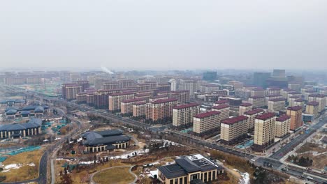 Vista-Aérea-De-Edificios-Futuristas-De-Nueva-Construcción-En-La-Ciudad-Futura,-Xiongan,-Provincia-De-Hebei,-China