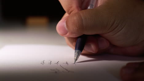 Macro-shot-of-slow-motion-practicing-writing-a-signature