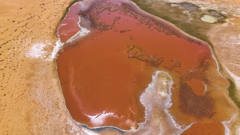 Bird's-eye-view-of-the-colorful-pink-waters-of-the-Wulan-Lake-in-the-Tengger-Desert,-Inner-Mongolia-Autonomous-Region,-China