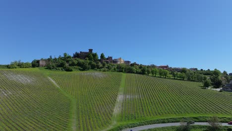 cinematic-aerial-journey-to-the-hillside-village-of-Gabiano,-Italy-and-beyond,-home-of-castles-and-excellent-wines