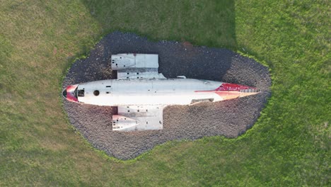 Aerial-top-down-view-of-the-DC-3-airplane-wreck-in-Eyvindarholt-along-the-Ring-Road-in-Iceland-during-summer