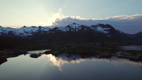 Aerial-Perspectives-of-Austnesfjorden-at-Sunset:-White-Peaks-and-Serene-Fjord
